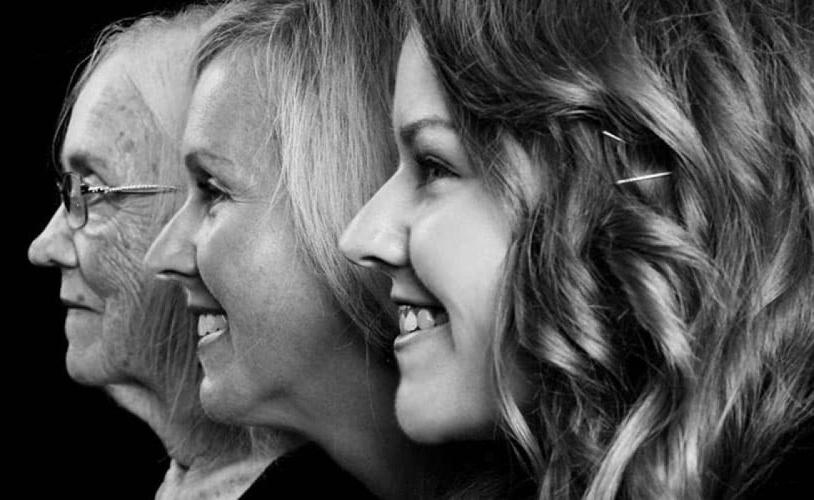 Profile view of three generations of women